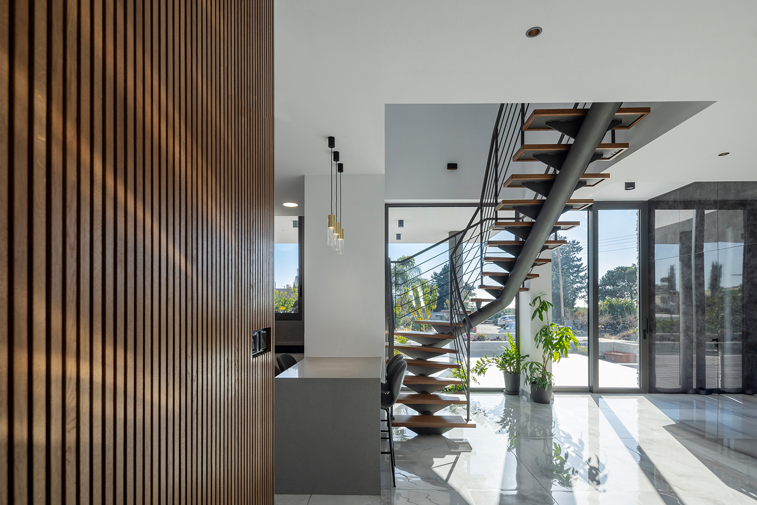 Perspective view of the sculptural curved staircase.